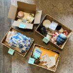 Decluttering baskets for how to start minimalist living with donate, keep, storage, and trash labels.
